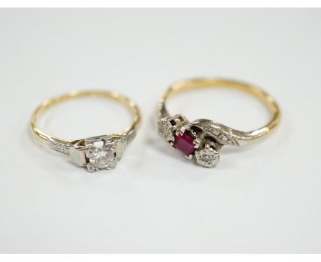 An 18ct, ruby and diamond chip set three stone crossover ring, size R and an 18ct, plat and solitaire diamond set ring, size 