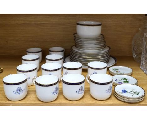 A Royal Worcester blue and gilt crested part tea set together with a set of seven floral Rosenthal miniature porcelain dishes