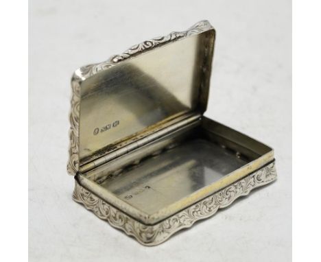 A Victorian engraved silver snuff box, by Nathaniel Mills, Birmingham, 1851, 66mm. Condition - fair