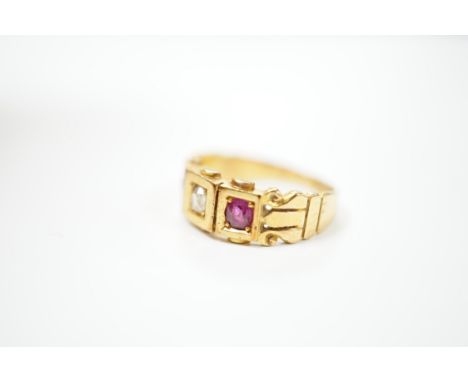 A late Victorian 18ct gold, ruby and diamond set three stone ring, size J, gross weight 4 grams. Condition - fair