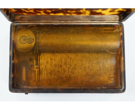 A 19th century tortoiseshell cased musical snuff box, 10cm. Condition-Mechanism has a transparent plastic sheet over the mech