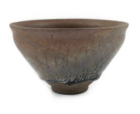 A Chinese 'hares fur' pottery bowl, Song Dynasty with a thick glaze pooling above the unglazed base, 12.2cm diameter. Provena
