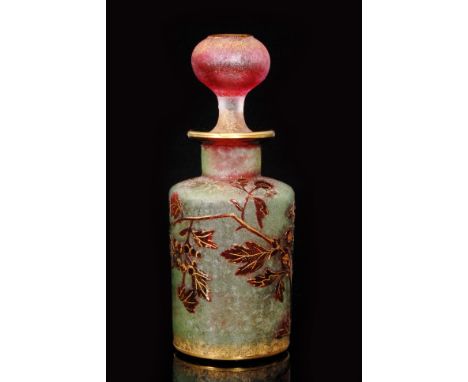 A large early 20th Century Baccarat cologne bottle of shouldered cylindrical form with large spherical stopper, cased in ruby