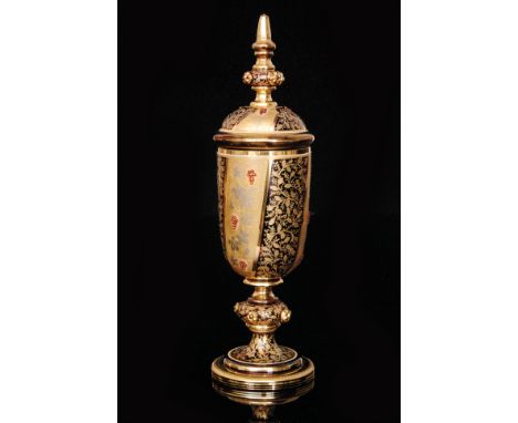 A 19th Century Bohemian pedestal cup and cover in the manner of Moser, slender ovoid bowl above a large knop and swept circul