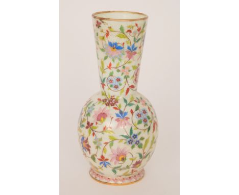 A late 19th Century French opaline glass vase of footed ovoid form with flared collar neck, heavy enamel and gilt decorated w