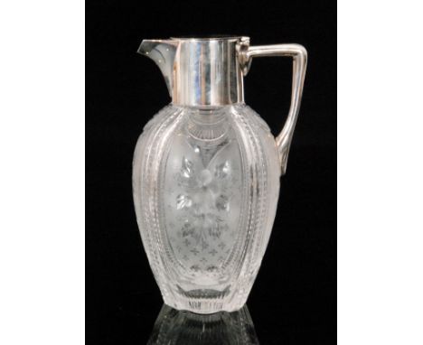 An Edwardian Stourbridge crystal glass claret jug possibly by Stevens & Williams. The swollen ovoid body with vertical ribs a