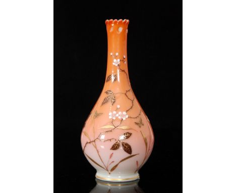 A late 19th Century Harrach glass vase of footed ovoid form with drawn collar neck and pierced detail at the upper rim, cased