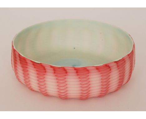 A late 19th Century Stevens & Williams glass bowl of shallow circular fluted form, cased in graduated pink over opal and deco