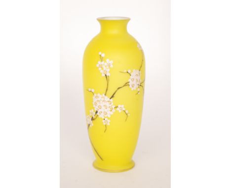 A late 19th Century Harrach vase of slender ovoid form with flared collar neck, cased in yellow over opal and enamel decorate