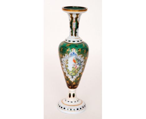 A large 19th Century Bohemian glass vase in the manner of Moser or Neuwelt, footed slender shouldered ovoid form with a tall 