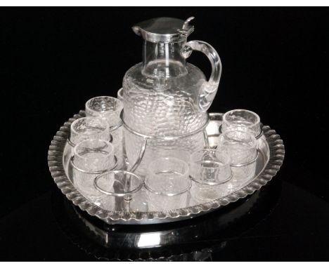 A late 19th Century Stevens & Williams clear crystal glass liqueur set comprising shouldered cylindrical spirit flask with pl