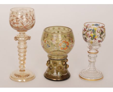 A small group of late 19th Century Bohemian enamel drinking glasses with applied and hand enamelled decoration to include nat