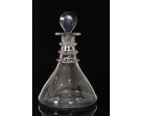 An 18th Century ships decanter circa 1770, wide base below a tapered conical body with three ring neck and lozenge stopper, h