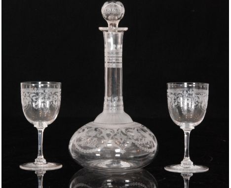 A late 19th Century Stourbridge clear crystal glass decanter circa 1870 of compressed globe and shaft form with a hollow blow