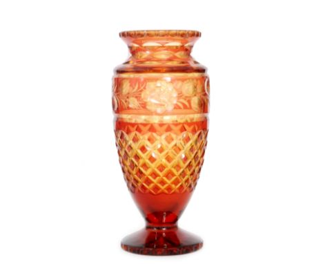 An early 20th Century Stevens & Williams double cased crystal glass vase of footed shouldered ovoid form with collar neck, ca