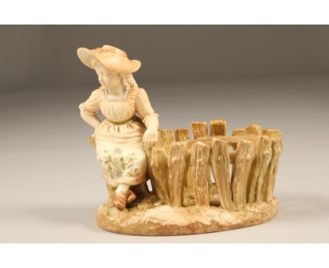 Royal Worcester figure, girl sitting on a tree stump at the edge of a Wicket fence, signed Hadley, date coded 1889 Height 17.