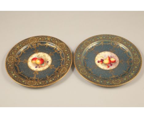 Pair Royal Worcester cabinet plates, blue ground with central hand painted panels of fruit signed M Bee, rich gilt scroll wor