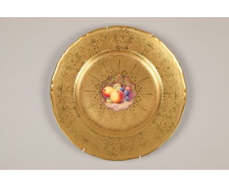 Royal Worcester cabinet plate, painted with a centre panel of fallen fruit within a tooled and etched rich gilded ground, sig