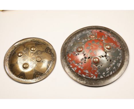 Late 19th/20th century North Indian/Persian brass and enamel circular pierced shield, the central boss with floral decoration