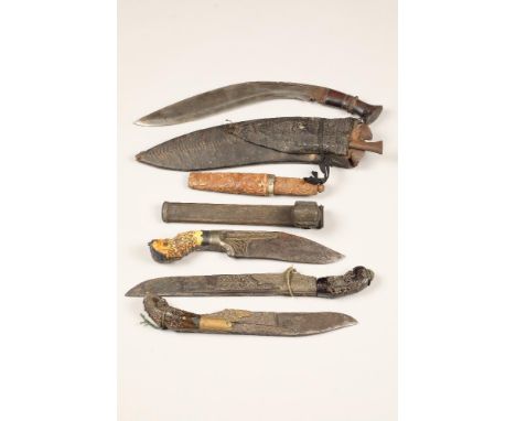 19th/ early 20th century Nepalese Kukri, together with three bone handled Indian daggers, each with carved handles, a 19th ce