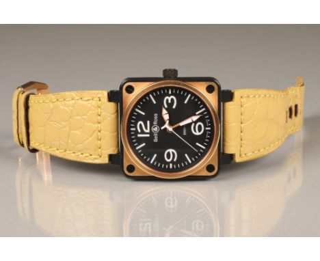 Gents Bell and Ross wristwatch, with black carbon case, with rose gold mounts, attached leather strap and three spare straps,