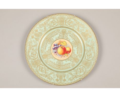 Royal Worcester cabinet plate, painted with a central panel of fallen fruit, within a pale blue ground with rich gilt decorat