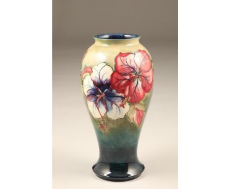 Moorcroft pottery vase, slender baluster form, decorated with hibiscus pattern, original paper label, signed, incised factory