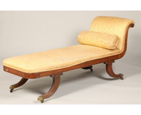 Regency mahogany scroll end chaise longue, raised on outswept reeded legs, terminating in castors.CONDITION REPORTA daybed – 