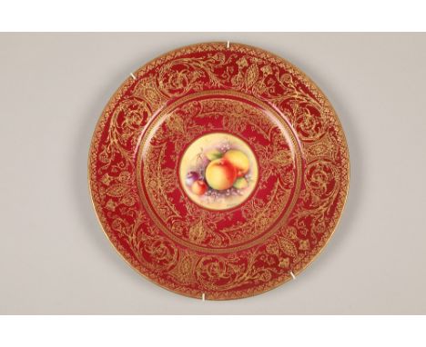 Royal Worcester cabinet plate, painted with a central panel of fallen fruit within a red ground with rich gilt decoration, si