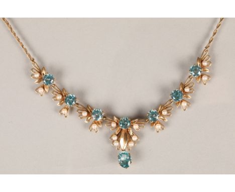 Ladies 9 carat gold aqua marine and pearl seed necklace, seven round brilliant cut aquamarines set with eighteen interspersed
