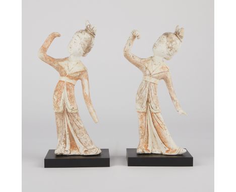 Pair of Chinese Tang Dynasty polychrome earthenware terracotta tomb figures dancing, well decorated and molded with evidence 