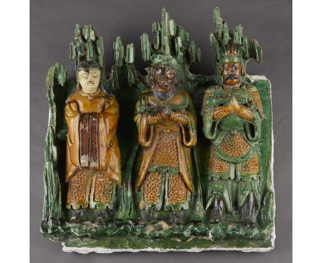 Chinese Ming dynasty ceramic figural architectural temple tile in high relief glazed with a green glaze background and yellow