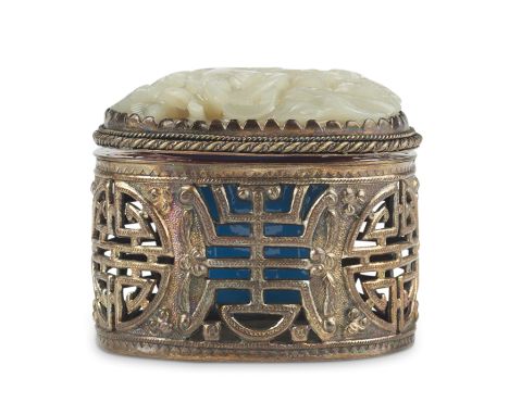 Chinese Republic period silver inkwell with a blue Peking glass insert and a lid that is surmounted by a pierced carved jade 