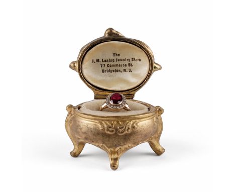 10K yellow gold synthetic ruby and imitation seed pearl ring housed in an Art Nouveau gilt case. The synthetic ruby has a ref