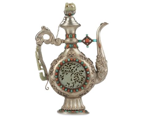 Chinese or Mongolian late Qing dynasty or early Republic period repousse silver ewer inlaid with coral and turquoise cabochon