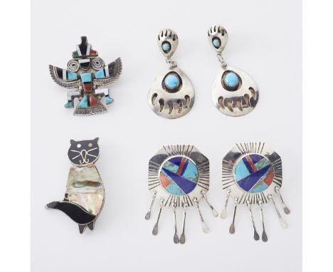 Group of Southwestern silver earrings and pendants. Includes two pairs of earrings and two pendants, set with turquoise, moth