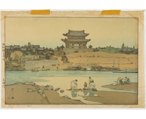 Hiroshi Yoshida (Japanese, 1876-1950).  Japanese woodblock print titled "Daido Gate," depicting a family washing laundry in f