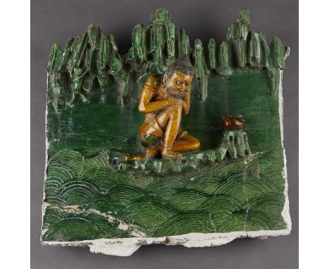 Chinese Ming dynasty ceramic figural architectural temple tile in high relief glazed with a green glaze background and yellow