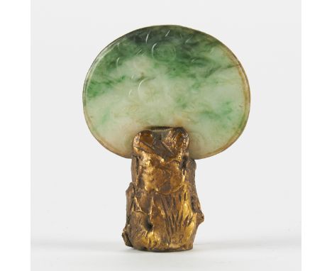 Small jade carving in white jade with spinach jade inclusions. Decorated with incised characters on one side and a design of 