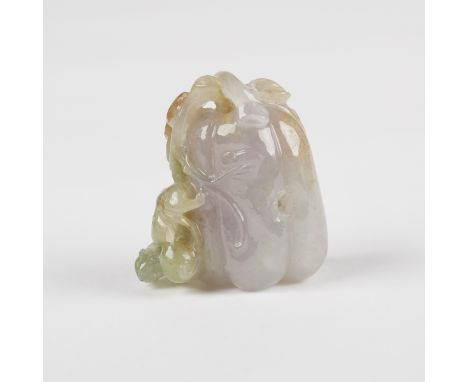 Chinese jade intricate carving of a melon. The stone is a pale celadon, lavender purple, and spinach green color with russet 