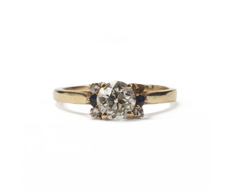 One 14K yellow gold diamond and sapphire women's ring. The ring centers an old European cut diamond of J-K color and clarity 