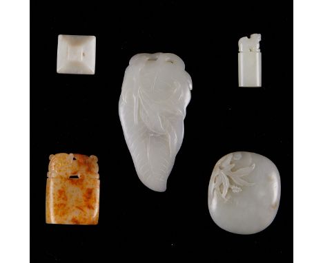 Group of five Chinese carved jade pieces. One large piece carved to resemble a leaf. One rounded plaque carved with leaves. T