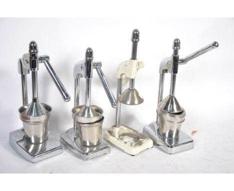 A group of 3 retro chrome juicers / extractors along with another vintage juicer