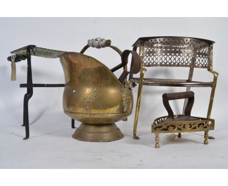 A collection of brass wares to include a coal scuttle an iron stand a various tools etc.