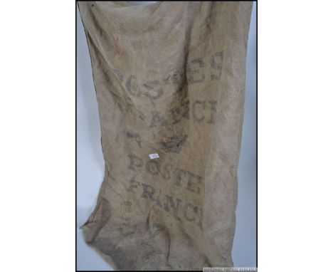 A vintage French Postal ( postes ) Hessian sack with advertising notation for Warein of Lille. Measures: 88cm x 66cm.