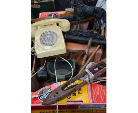 A mixed lot to include a bakelite phone , vintage model boat , French flag , brass horse door stop etc.