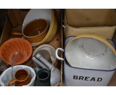 A collection of kitchenalia ro include Victorian jelly moulds , enamel bread bins , large mixing bowl etc. (please see images
