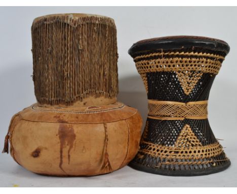 A collection of tribal wears to include a woven chair with leather seat , African drum and a tribal sitting cushion amongst o