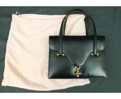 Black leather vintage Hermés handbag with gold hardware marked Hermés Paris in gold to interior, interior is leather and cont