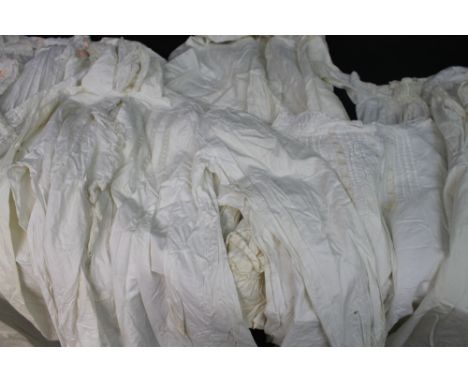 Modern suitcase full of late 19th/early 20th Century cotton clothing to include: petticoats, nightgowns, christening gown and